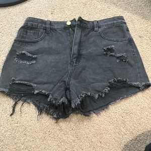 Black ripped jean shorts. Size Large